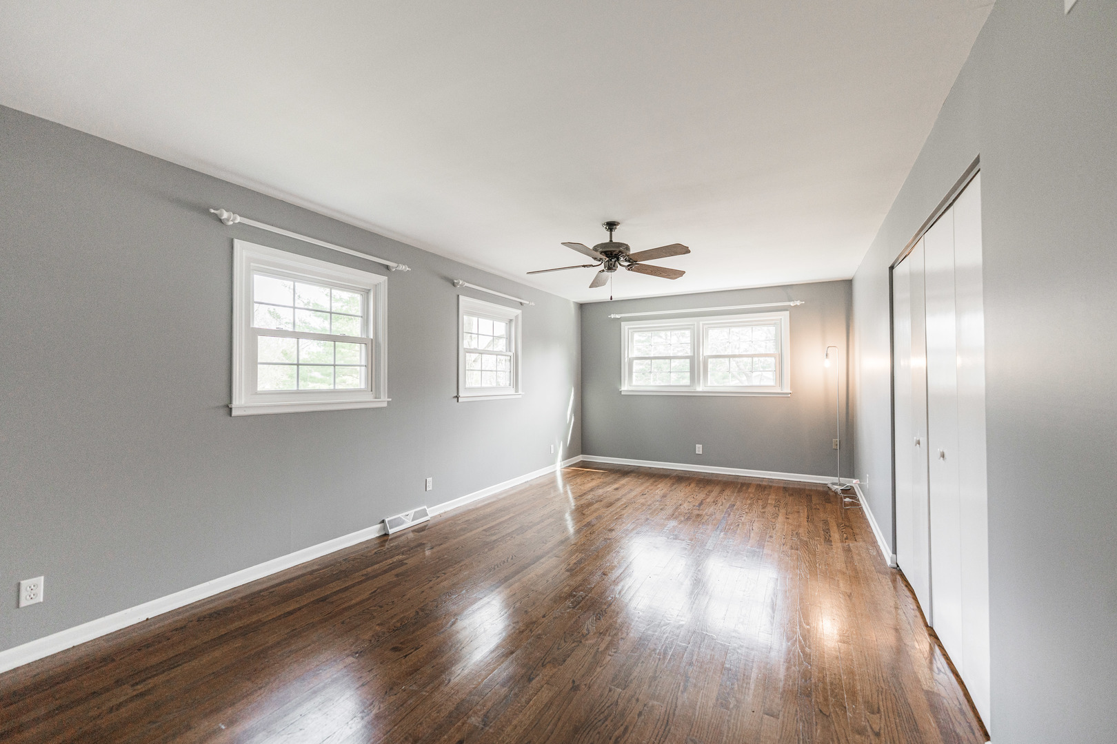 2S739 Nelson Lake Road Batavia, IL 60510 - Photo 42 of 65 an empty room with wooden floor chandelier and windows