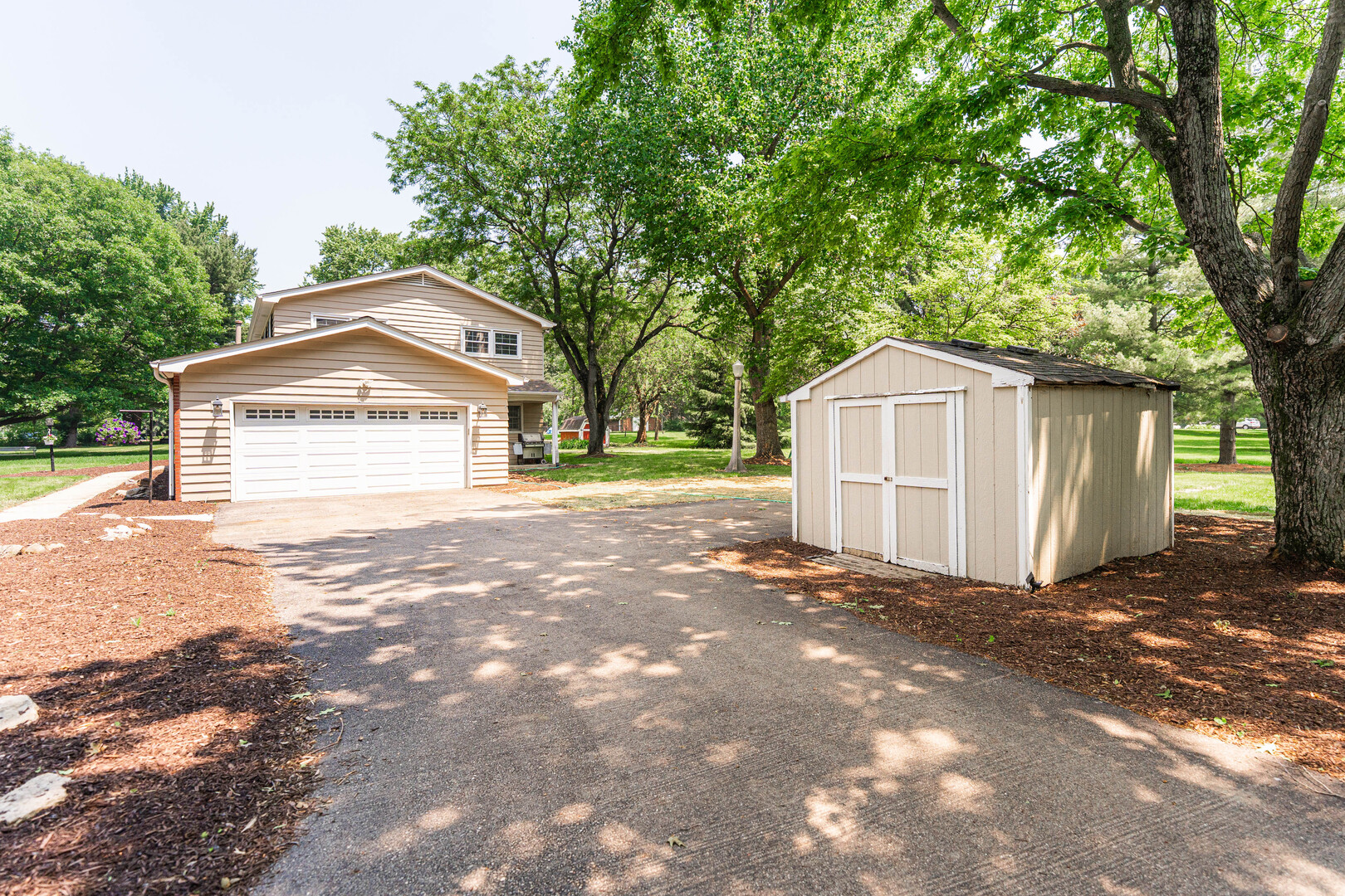 2S739 Nelson Lake Road Batavia, IL 60510 - Photo 52 of 65 a front view of a house with a yard and garage