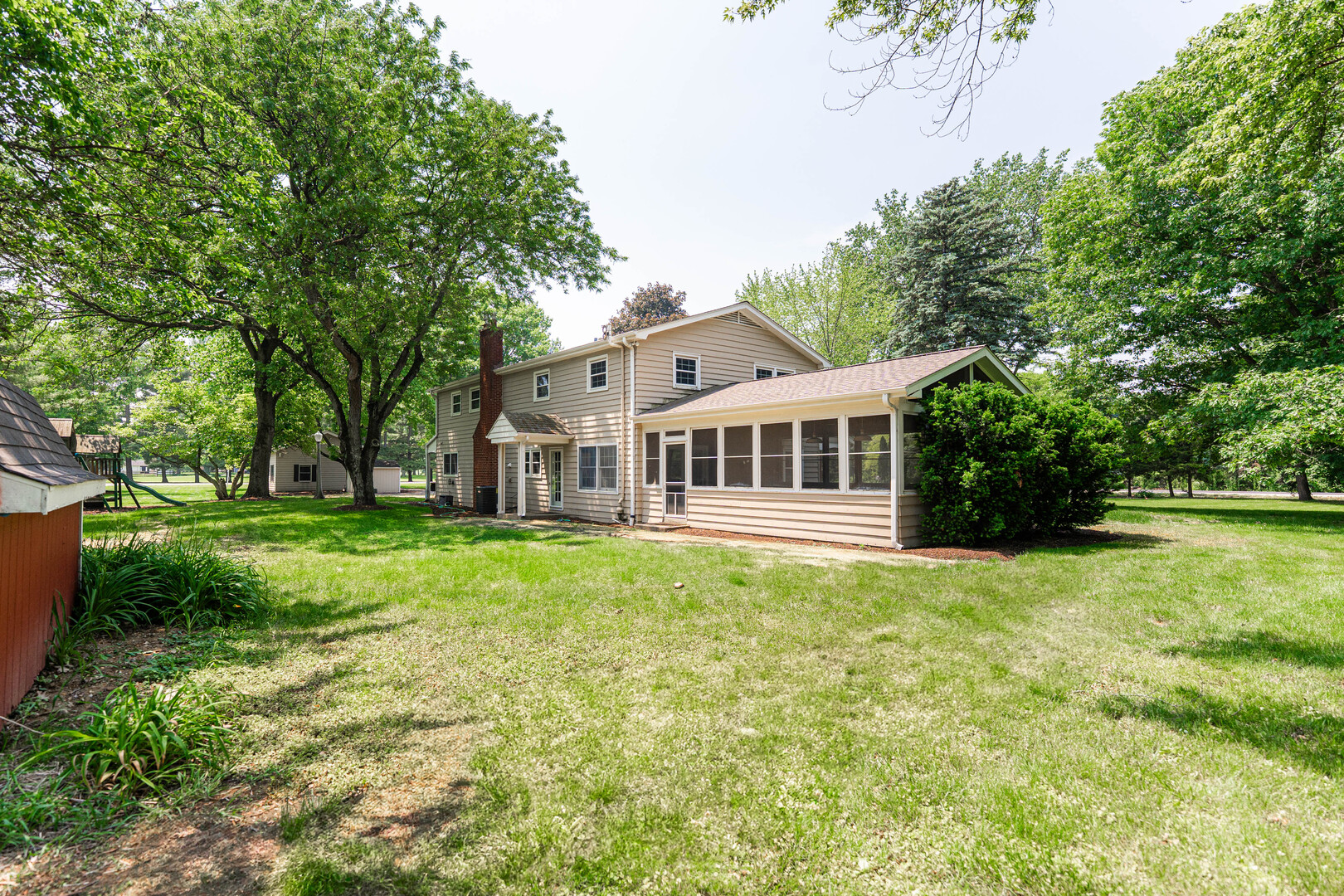 2S739 Nelson Lake Road Batavia, IL 60510 - Photo 55 of 65 a front view of a house with a garden