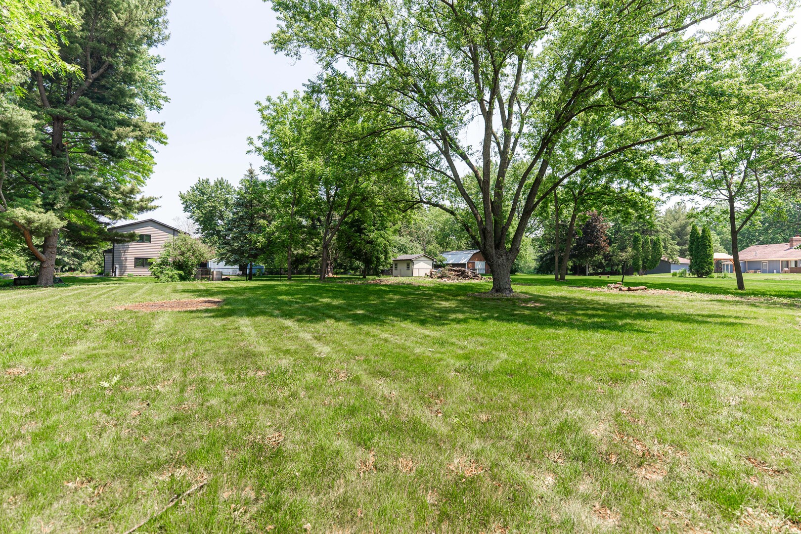 2S739 Nelson Lake Road Batavia, IL 60510 - Photo 59 of 65 a view of grassy field with benches and trees all around