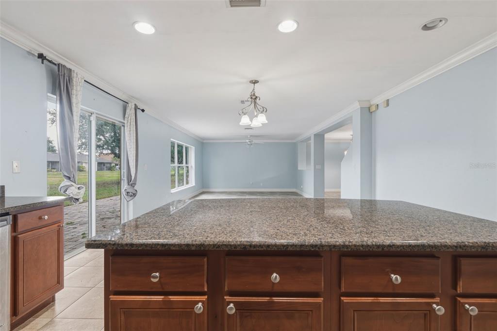 25134 Palisade Road Punta Gorda, FL 33983 - Photo 28 of 58 a view of kitchen island with granite countertop cabinets and sink