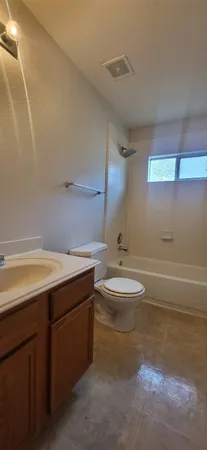 a bathroom with a sink a toilet and a shower