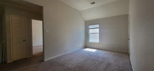 a view of empty room with windows