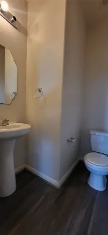 a bathroom with a toilet and a sink