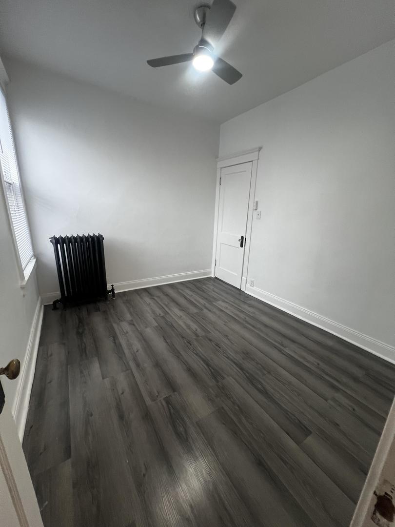 5461 West Haddon Avenue, Unit 2 Chicago, IL 60651 - Photo 11 of 21 wooden floor in an empty room