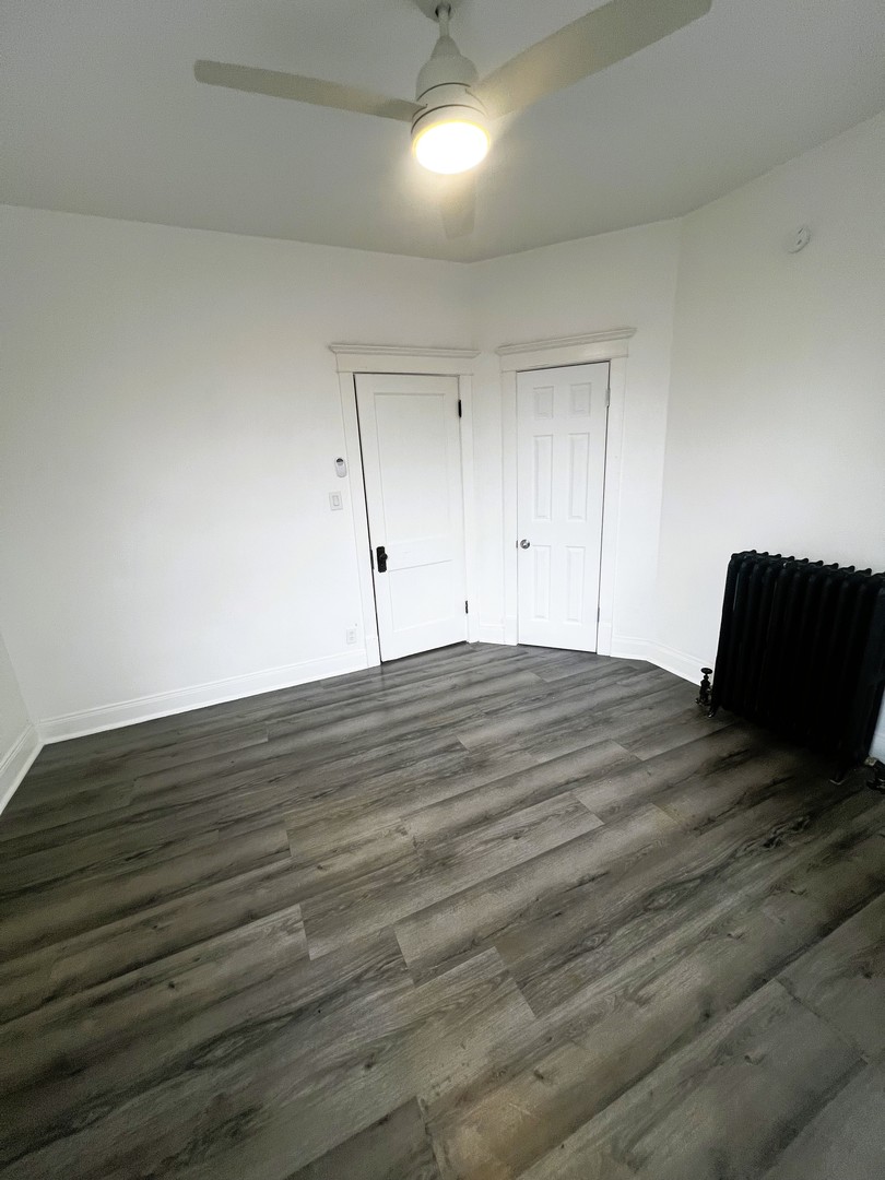 5461 West Haddon Avenue, Unit 2 Chicago, IL 60651 - Photo 10 of 21 a view of empty room with wooden floor