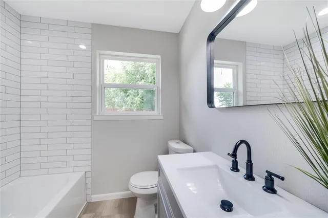 a bathroom with a sink and a bathtub