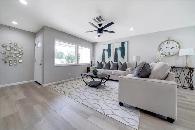a living room with furniture and a window