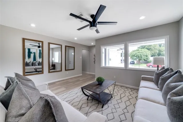 a living room with furniture and window