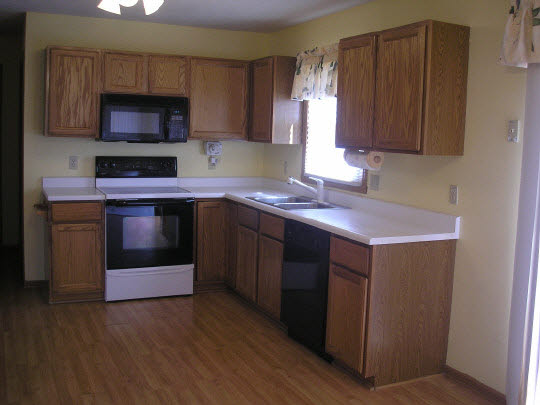 5403 Torque Road Loves Park, IL 61111 - Photo 3 of 5 a kitchen with stainless steel appliances a stove a sink and a microwave