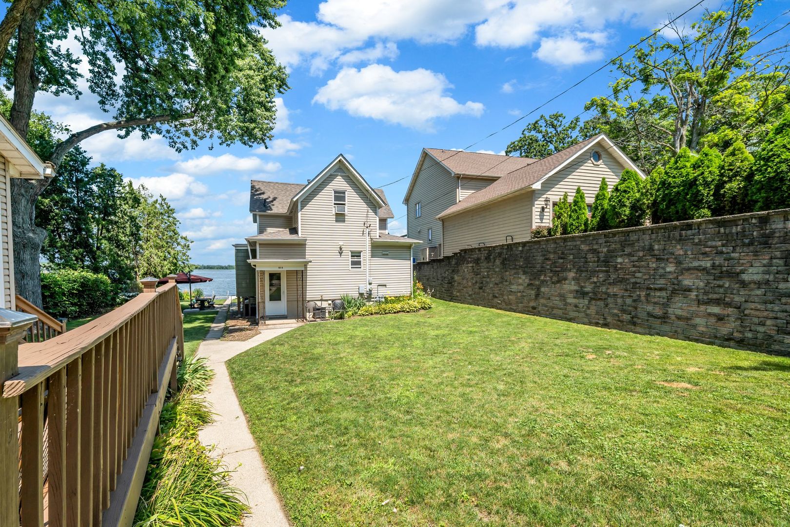 4018 Pitzen Road Johnsburg, IL 60051 - Photo 10 of 47 a view of a house with wooden fence