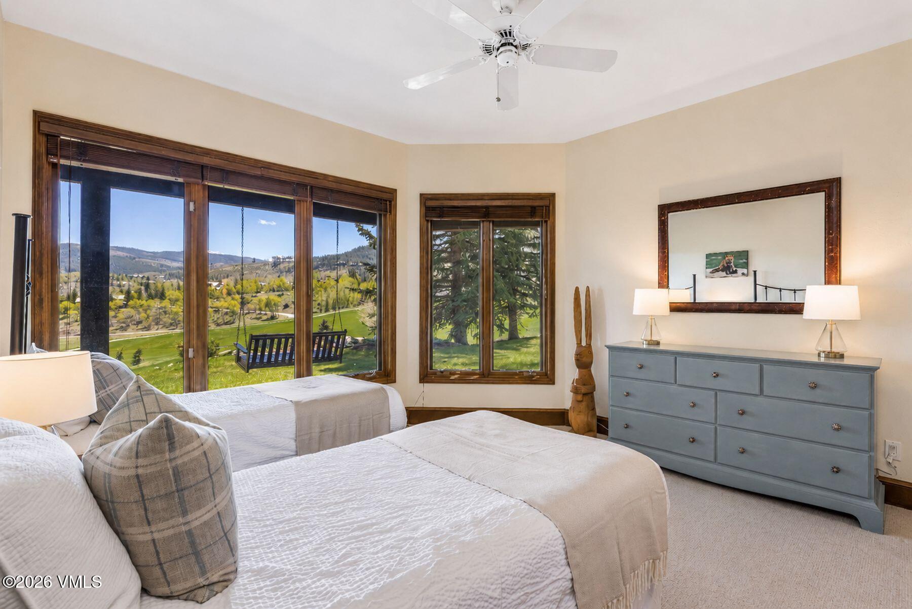 167 Saddle Ridge Edwards, CO 81632 - Photo 27 of 41 a bedroom with a large bed and a dresser