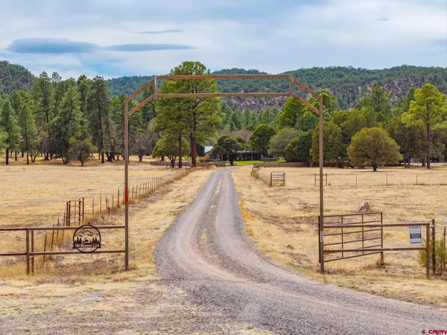 a view of a swimming pool with an outdoor seating