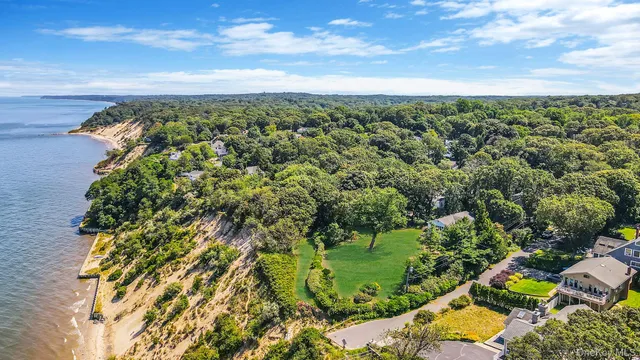 an aerial view of a houses with a yard