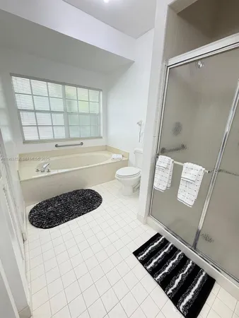 a view of an empty room with a closet