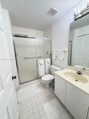a view of a hallway with washer and dryer