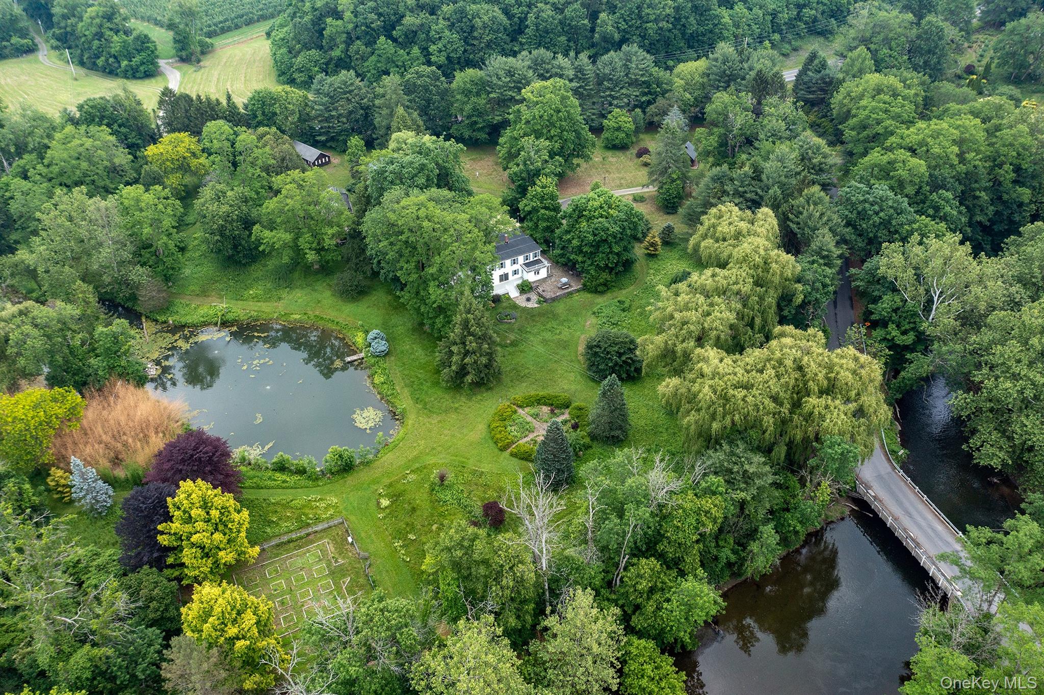 202 Buckwheat Road Hudson, NY 12534 - Photo 49 of 49 an aerial view of residential house with outdoor space and trees all around