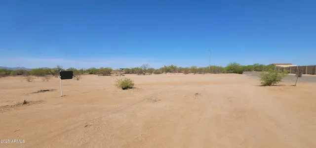 a view of a road with a building in the background