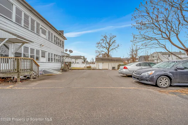 a view of a city street with a large building