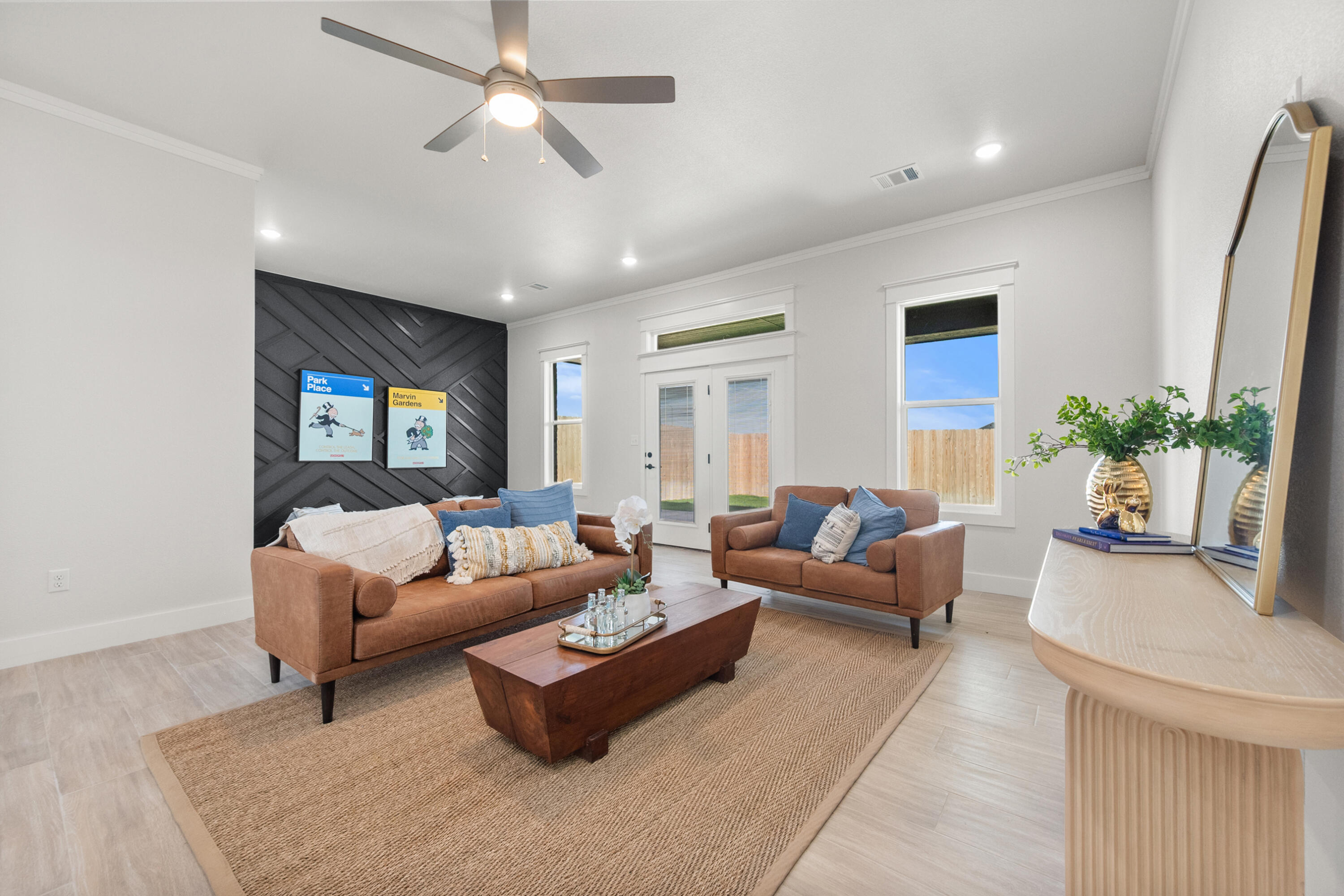 7526 57th Street Lubbock, TX 79407 - Photo 19 of 36 a living room with furniture and a chandelier
