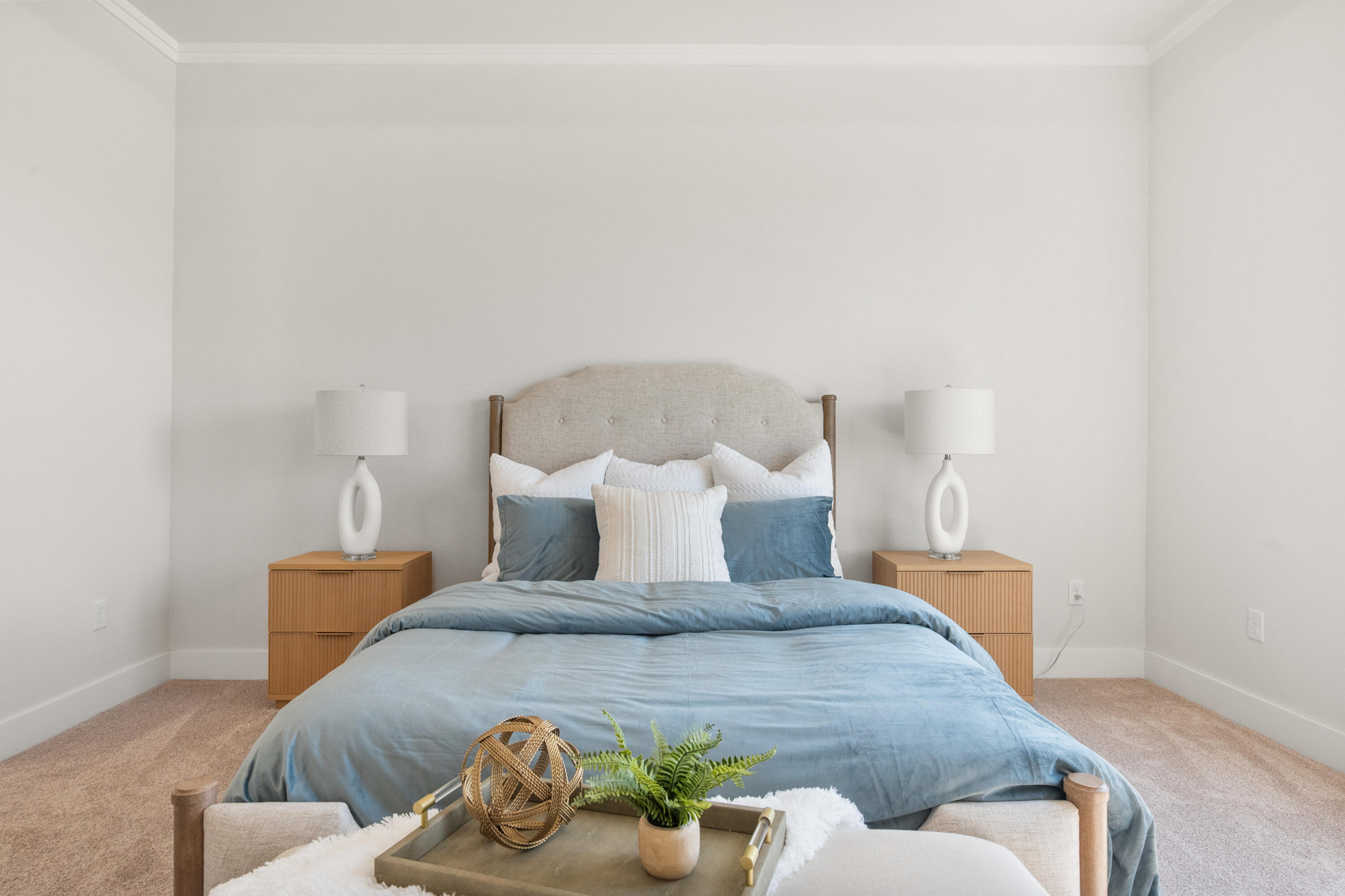 7526 57th Street Lubbock, TX 79407 - Photo 22 of 36 a bed sitting in a bedroom with a potted plant