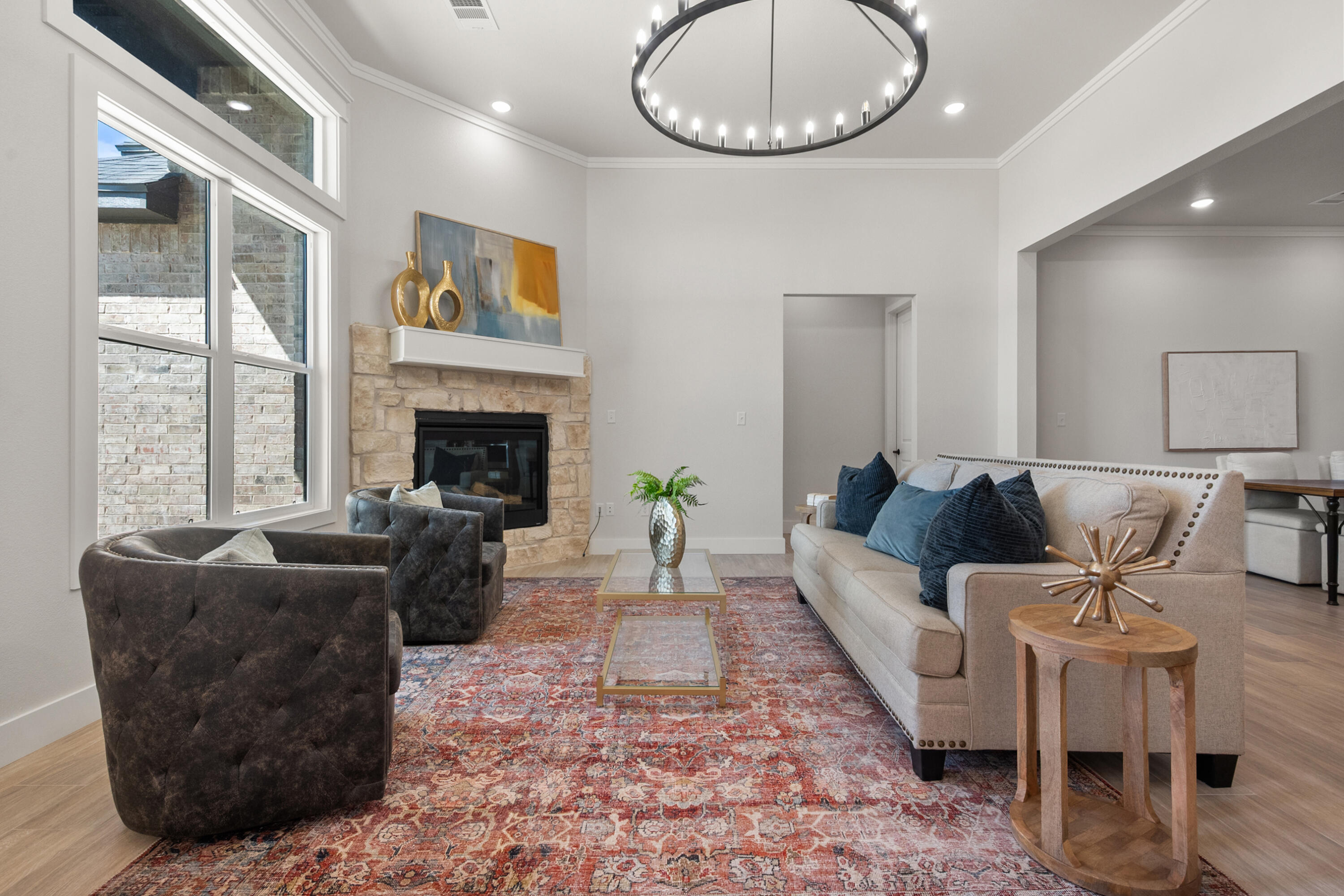 7526 57th Street Lubbock, TX 79407 - Photo 3 of 36 a living room with furniture a fireplace and a large window
