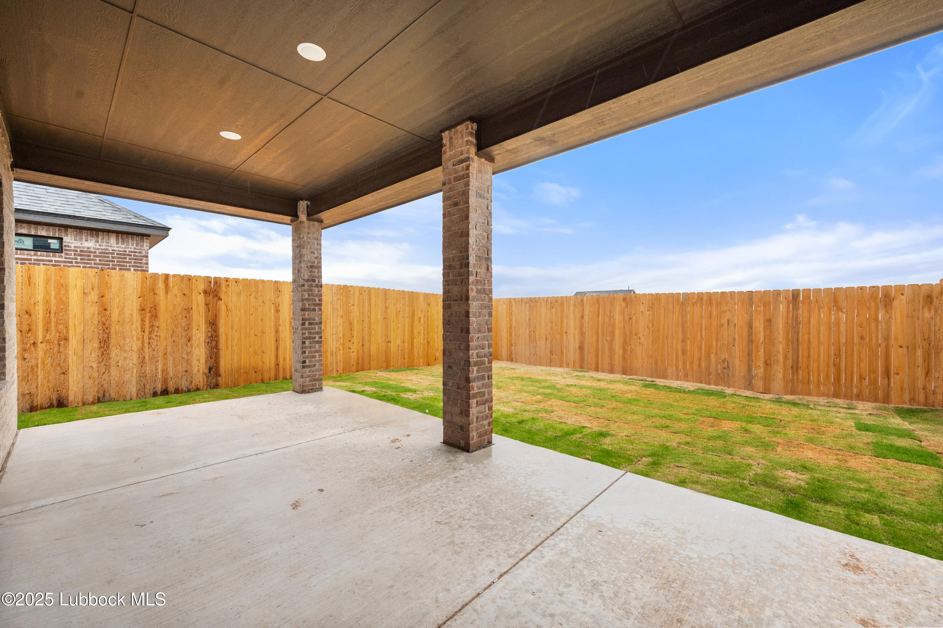 7526 57th Street Lubbock, TX 79407 - Photo 35 of 36 a view of an empty room with a sliding door