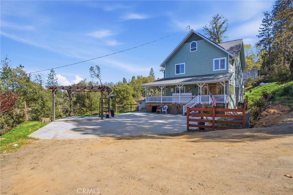 5769 Clouds Rest Mariposa, CA 95338 - Photo 3 of 49 a front view of a house with a yard