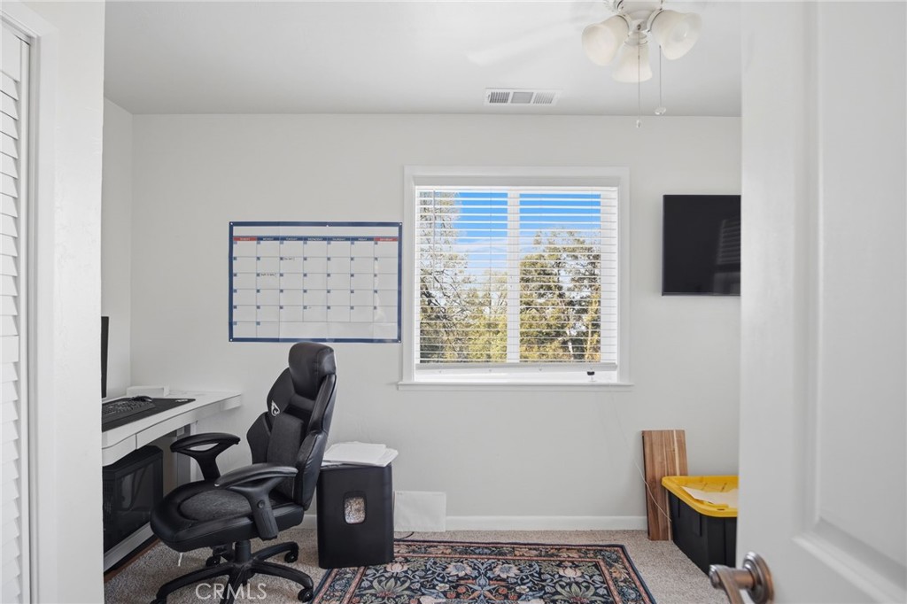 5769 Clouds Rest Mariposa, CA 95338 - Photo 39 of 49 a view of a workspace with furniture and a window