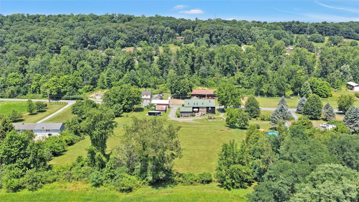 101 Conrad Road Fleetwood, PA 19522 - Photo 37 of 42 Rolling green hills and dense woodlands surround this private, verdant property.