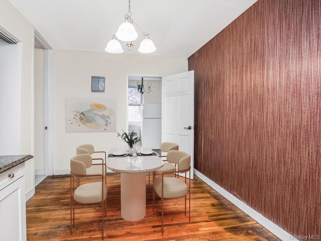 6535 Broadway, Unit 2E Bronx, NY 10471 - Photo 4 of 11 a dining room with furniture and wooden floor