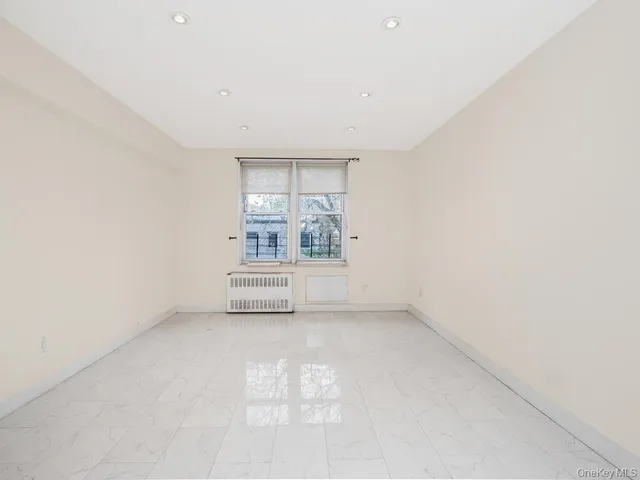 an empty room with a empty space and windows