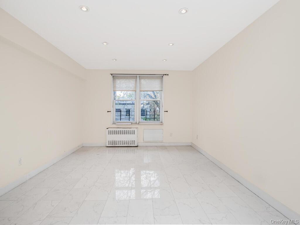 6535 Broadway, Unit 2E Bronx, NY 10471 - Photo 10 of 11 an empty room with a empty space and windows