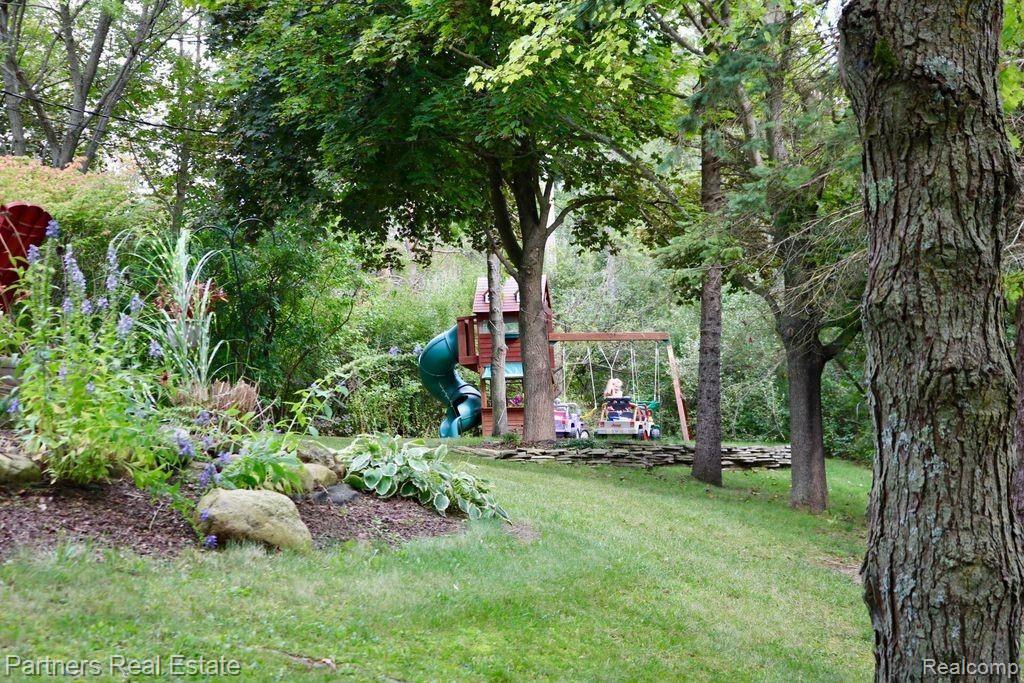 1859 Echo Hills Road Howell, MI 48855 - Photo 71 of 73 Backyard w Swingset.jpg