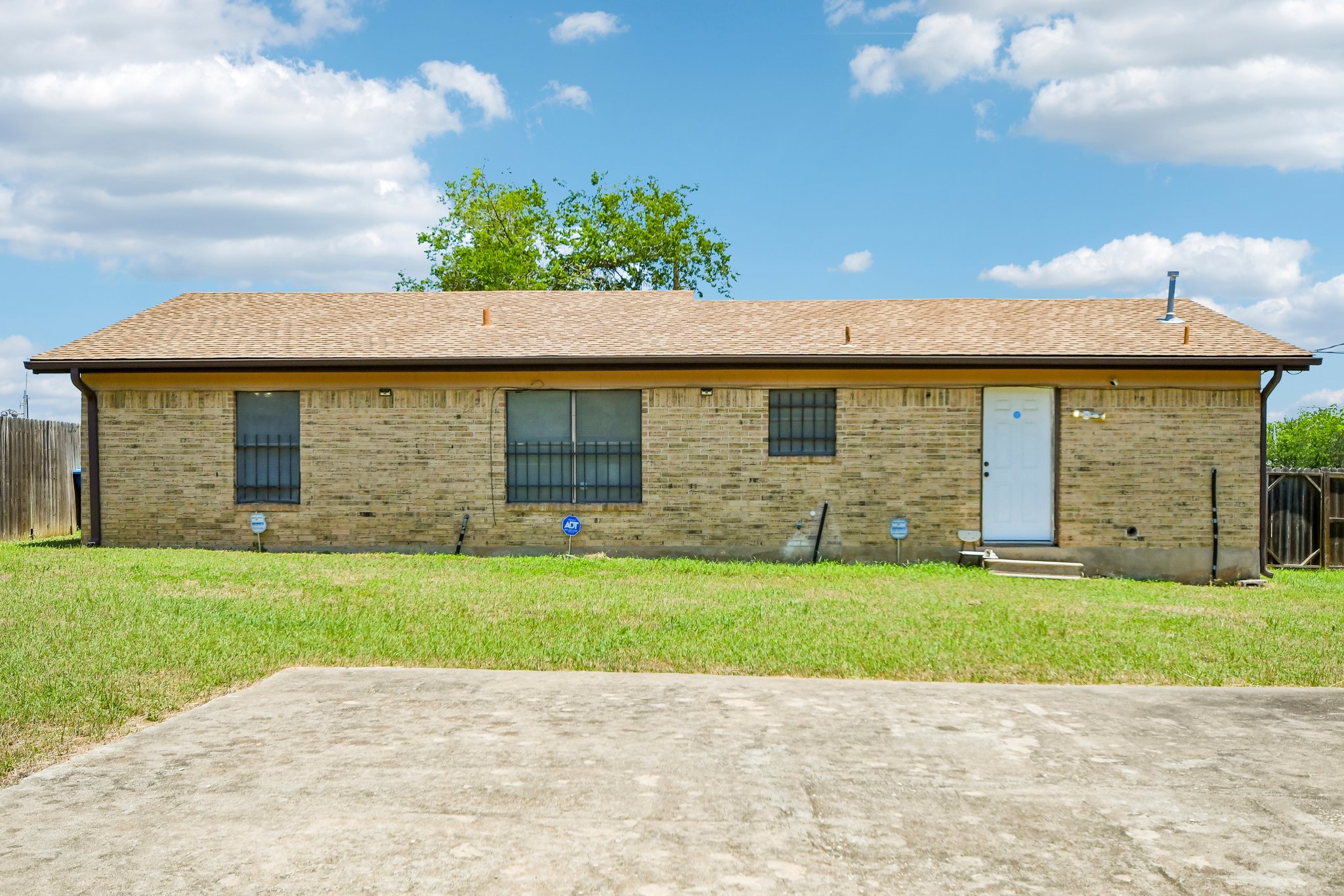 101 Brown Street Elgin, TX 78621 - Photo 26 of 32 a view of a house with a backyard