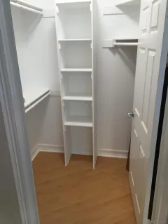 a view of an empty walk in closet