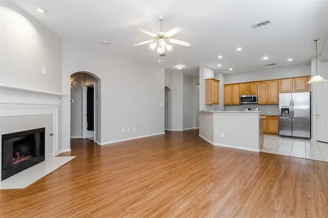 a view of a kitchen with wooden floor and a kitchen