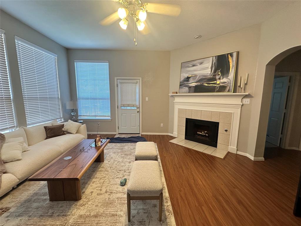 2450 Streamside Court Frisco, TX 75036 - Photo 12 of 28 a living room with furniture and a fireplace