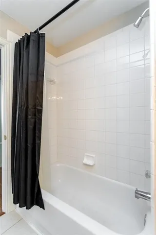 a bathroom with a shower and a bathtub