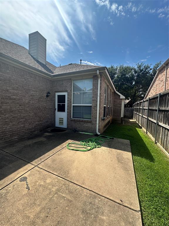 2450 Streamside Court Frisco, TX 75036 - Photo 24 of 28 a view of backyard of house with wooden fence