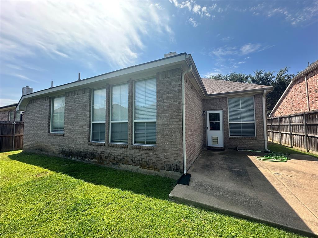 2450 Streamside Court Frisco, TX 75036 - Photo 25 of 28 front view of a house with a yard
