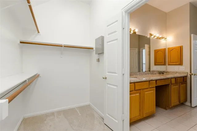 a view of a bathroom with a sink and mirror