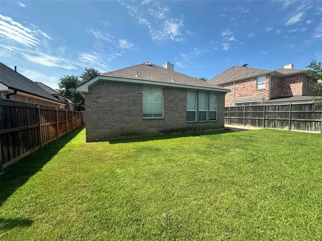 a view of outdoor space with deck and yard