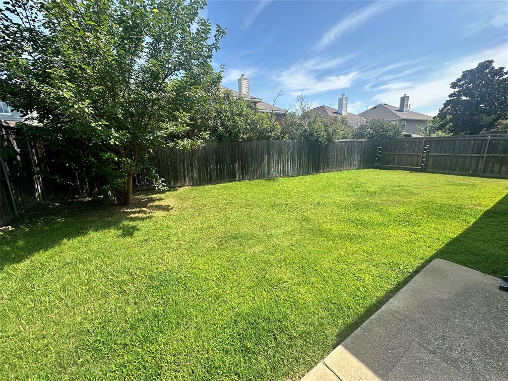 2450 Streamside Court Frisco, TX 75036 - Photo 27 of 28 a view of outdoor space with deck and yard