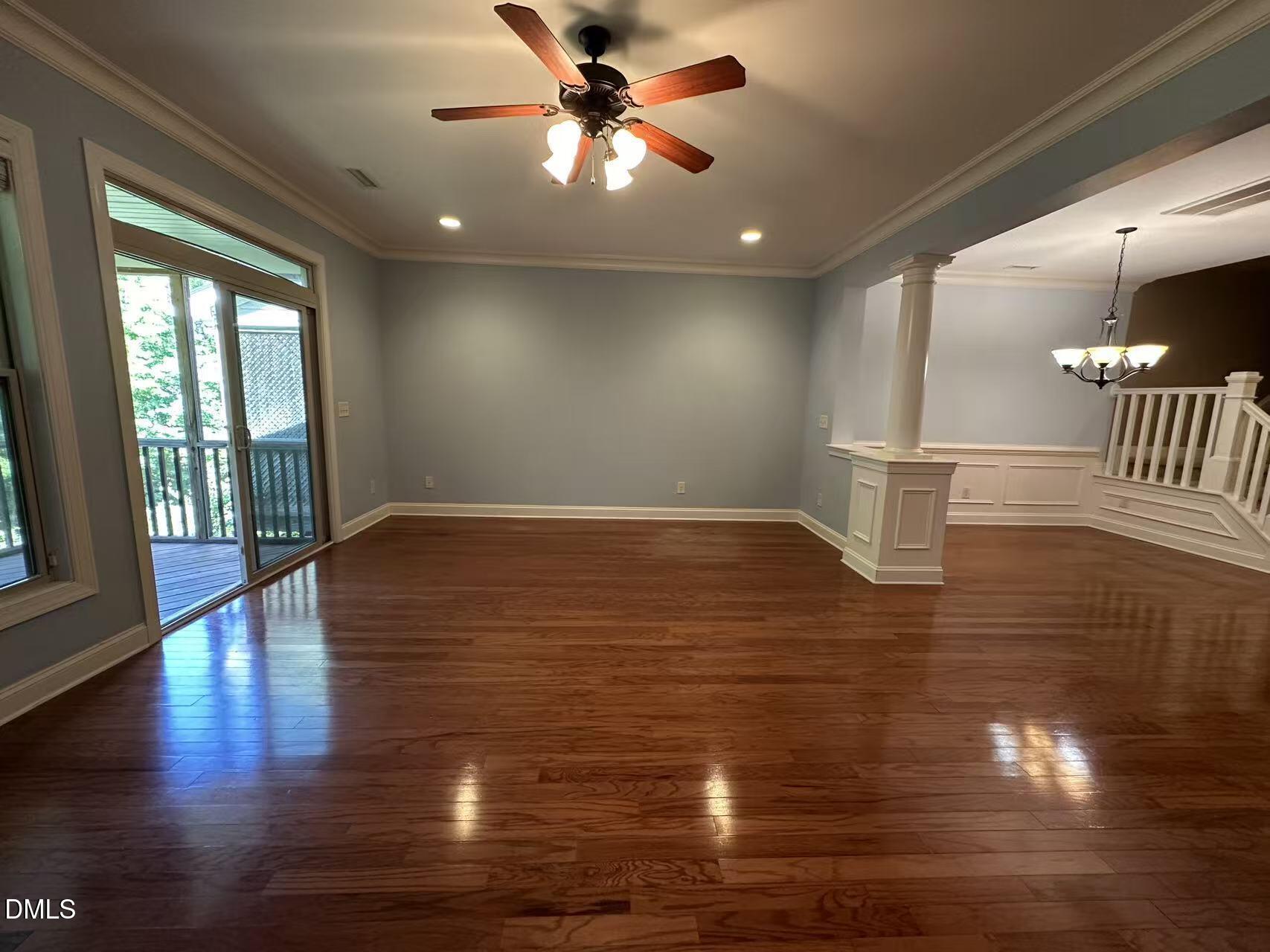 1056 Indigo Ridge Place Cary, NC 27519 - Photo 11 of 33 a view of empty room with wooden floor and fan