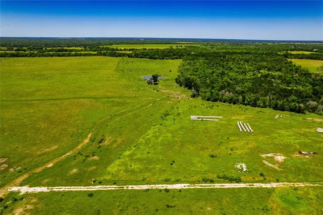 a view of a field with an outdoor space