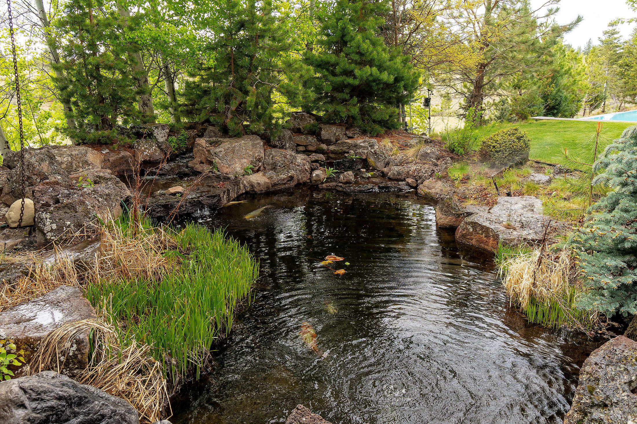 18883 Sutherland Court Bend, OR 97702 - Photo 40 of 70 A tranquil water feature creates a soothing focal point for the estate?s landscaped grounds.