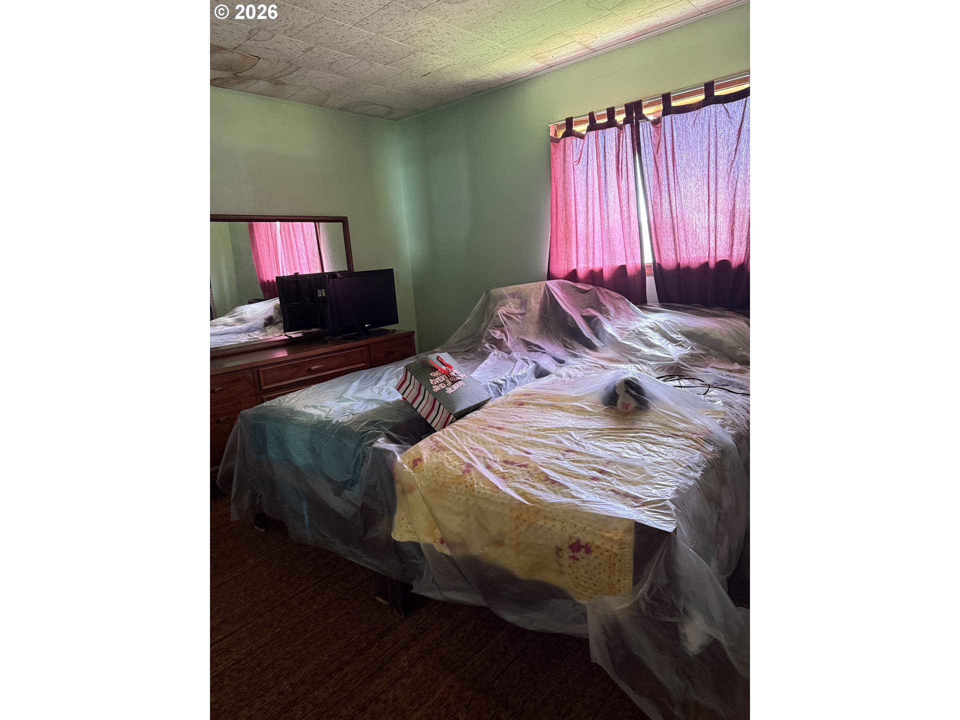 375 College Street Adams, OR 97810 - Photo 13 of 20 a bedroom with a bed and a television