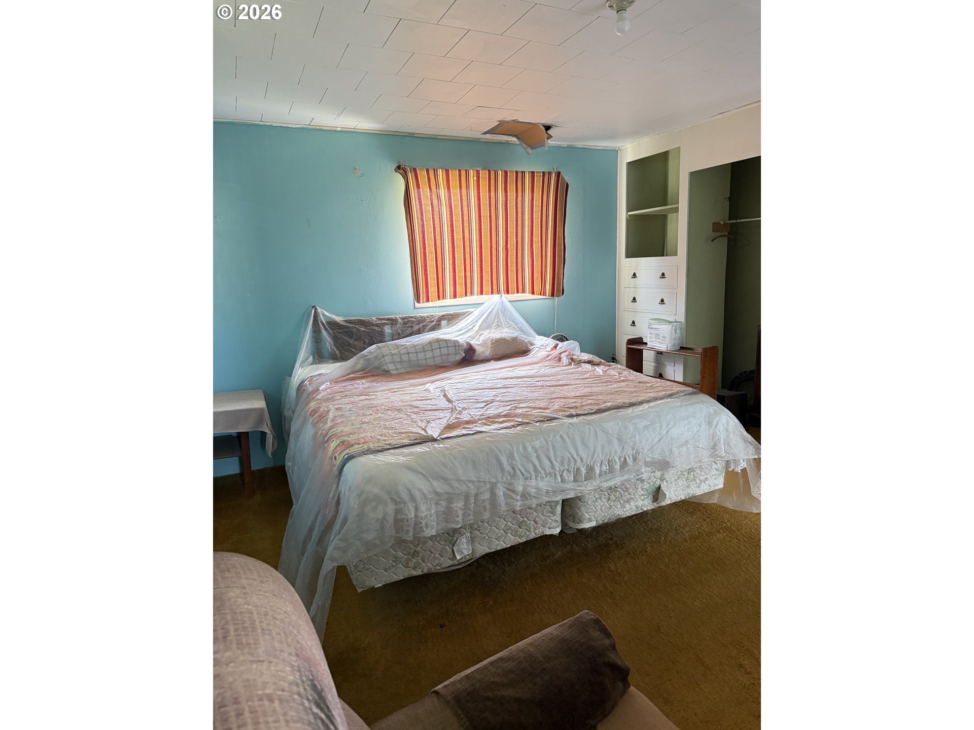 375 College Street Adams, OR 97810 - Photo 15 of 20 a bed sitting in a bedroom next to a window