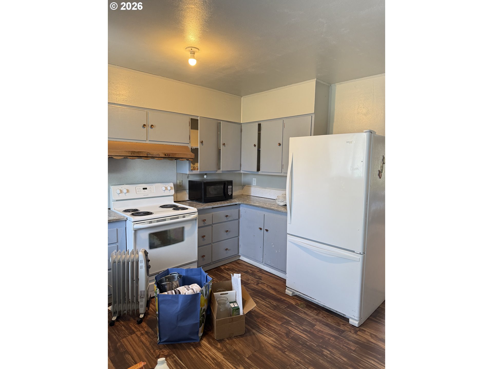 375 College Street Adams, OR 97810 - Photo 3 of 20 a kitchen with a refrigerator and a stove